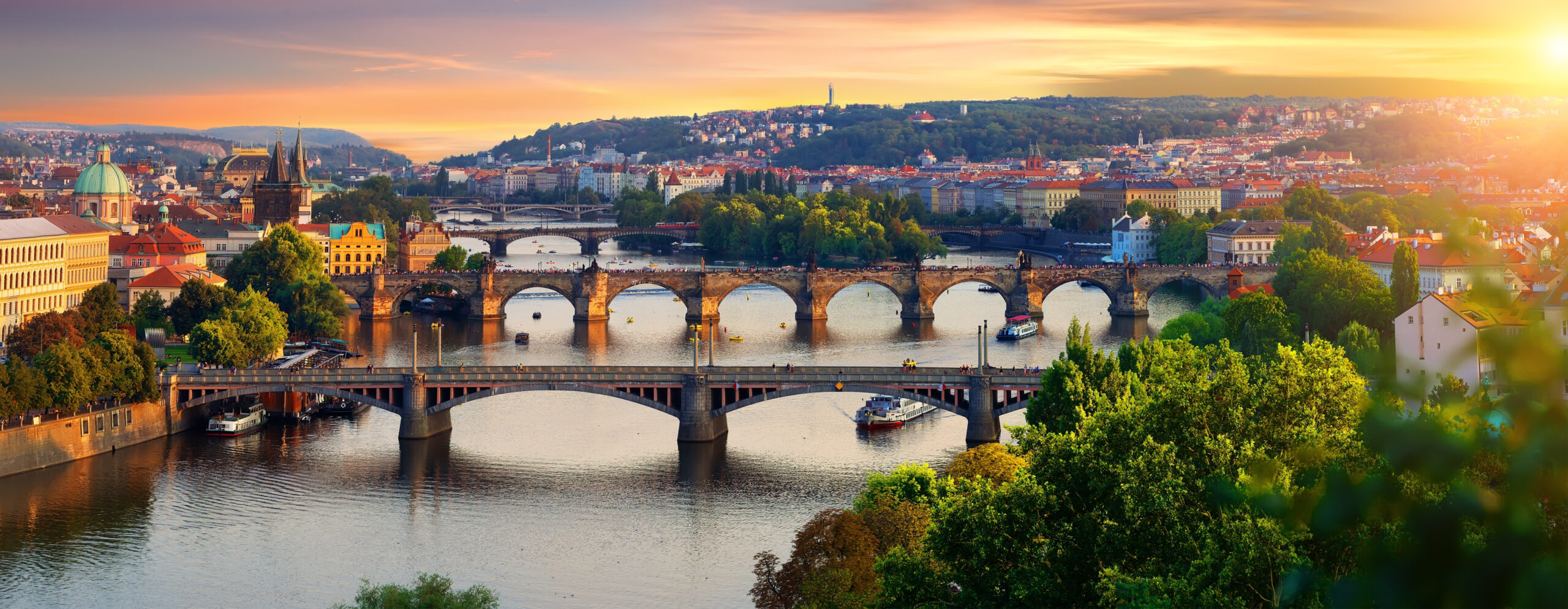 Overview of old Prague with Charles bridge at sunset